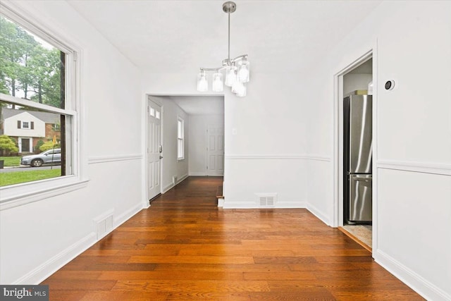5901 Euclid, Cheverly, MD 20785 - unfurnished dining area with a chandelier, healthy amount of natural light, and wood finished floors