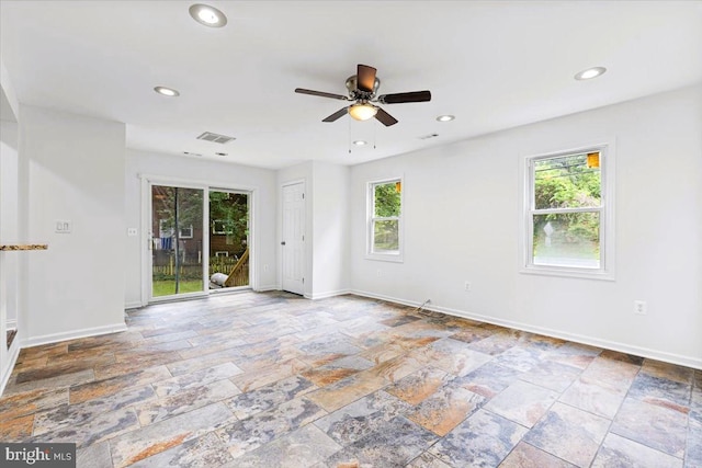 5901 Euclid, Cheverly, MD 20785 - unfurnished room featuring plenty of natural light, stone tile flooring, ceiling fan, and recessed lighting