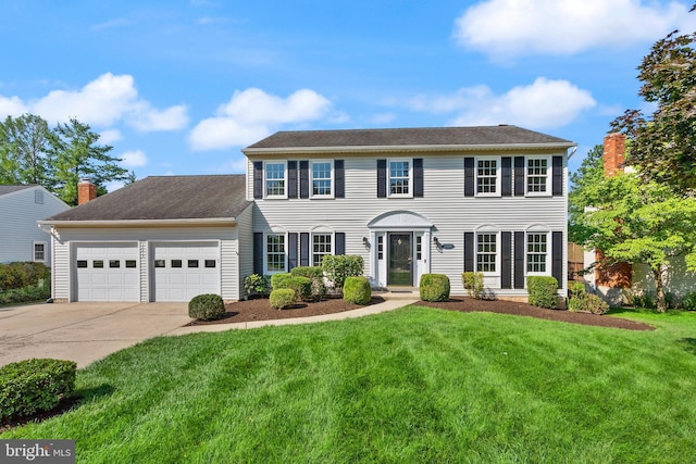 13619 Flintwood Pl, Herndon, VA 20171 - colonial-style house with a garage, driveway, and a front lawn