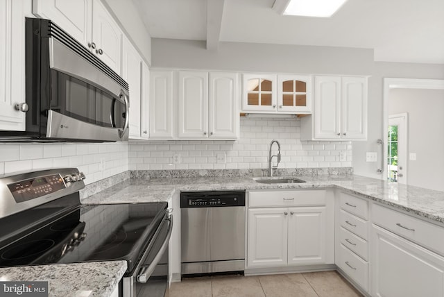 13619 Flintwood Pl, Herndon, VA 20171 - kitchen with appliances with stainless steel finishes, tasteful backsplash, white cabinets, light tile patterned floors, and light stone counters