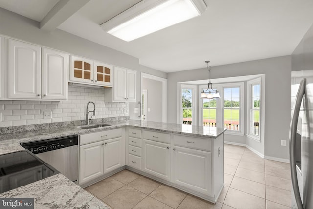 13619 Flintwood Pl, Herndon, VA 20171 - kitchen with stainless steel appliances, light tile patterned floors, white cabinetry, and backsplash