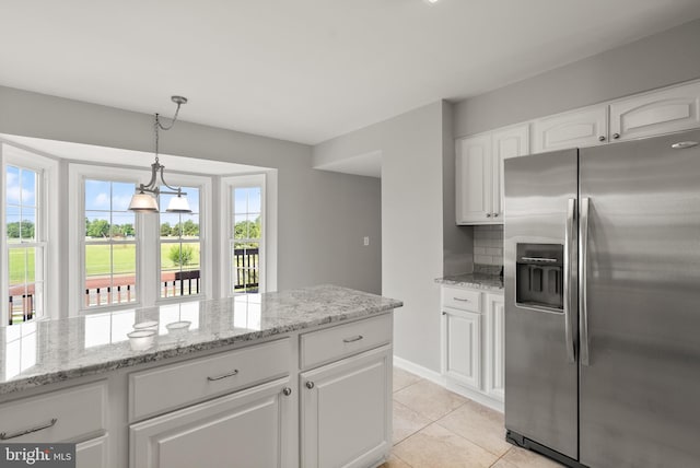 13619 Flintwood Pl, Herndon, VA 20171 - kitchen with stainless steel refrigerator with ice dispenser, plenty of natural light, white cabinets, and light tile patterned floors