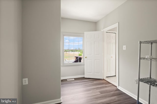 13619 Flintwood Pl, Herndon, VA 20171 - unfurnished bedroom with wood finished floors and baseboards