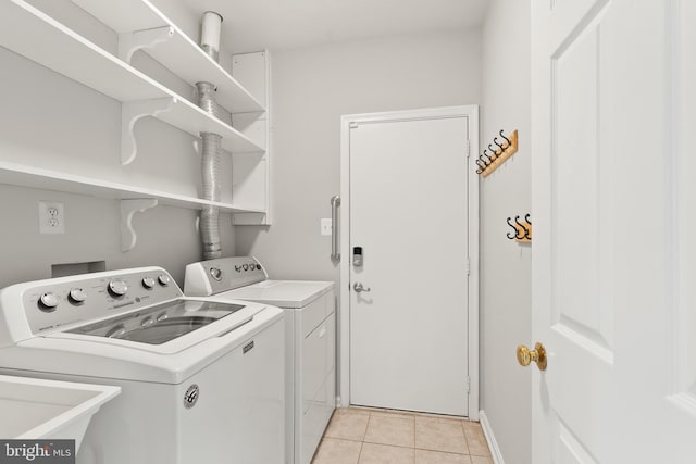 13619 Flintwood Pl, Herndon, VA 20171 - laundry area with independent washer and dryer and light tile patterned floors