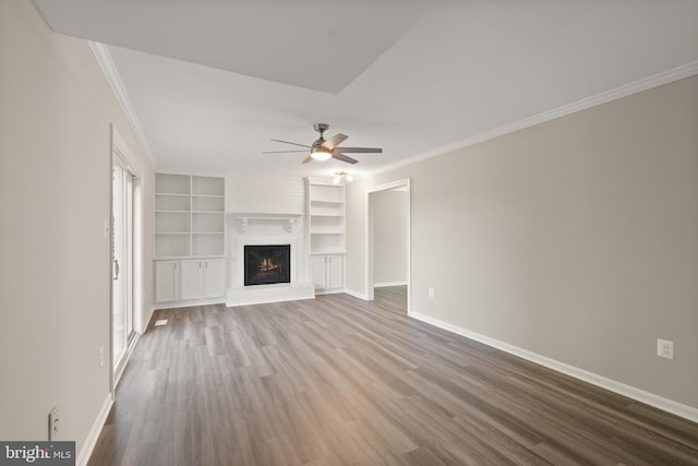 13619 Flintwood Pl, Herndon, VA 20171 - unfurnished living room with wood finished floors, ornamental molding, a ceiling fan, a large fireplace, and built in features