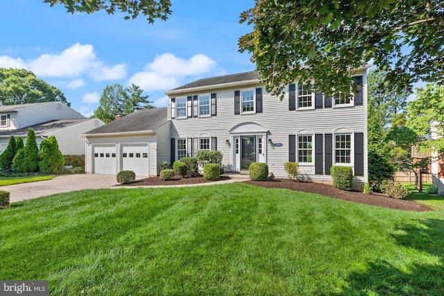 13619 Flintwood Pl, Herndon, VA 20171 - colonial house with an attached garage, concrete driveway, and a front yard