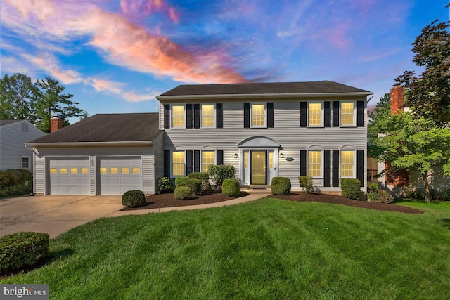 13619 Flintwood Pl, Herndon, VA 20171 - colonial home with a garage, concrete driveway, a front yard, and a chimney