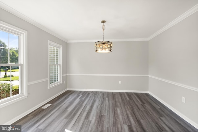 13619 Flintwood Pl, Herndon, VA 20171 - unfurnished dining area with healthy amount of natural light, dark wood-style flooring, a chandelier, and crown molding