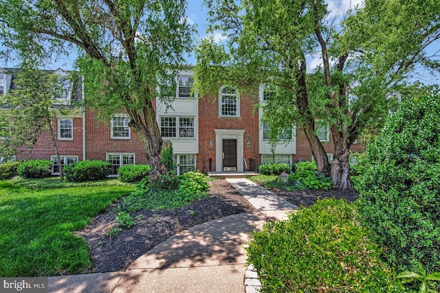 349 Homeland Southway Unit 1A, Baltimore, MD 21212 - view of front of home featuring brick siding and a front yard