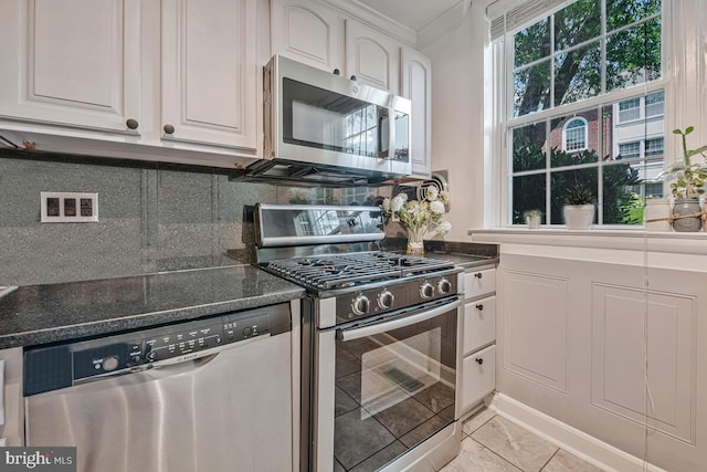 349 Homeland Southway Unit 1A, Baltimore, MD 21212 - kitchen with appliances with stainless steel finishes, decorative backsplash, white cabinets, and dark stone counters