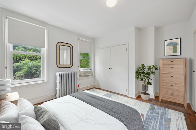 2205 Pine St, Philadelphia, PA 19103 - bedroom featuring radiator, dark wood-type flooring, a closet, and cooling unit