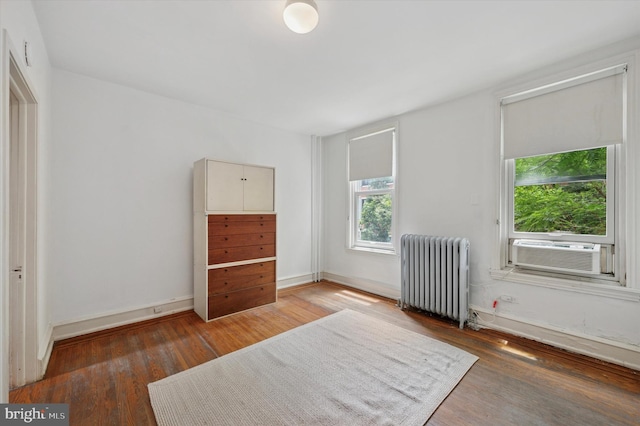 2205 Pine St, Philadelphia, PA 19103 - unfurnished bedroom featuring radiator heating unit, cooling unit, and wood finished floors
