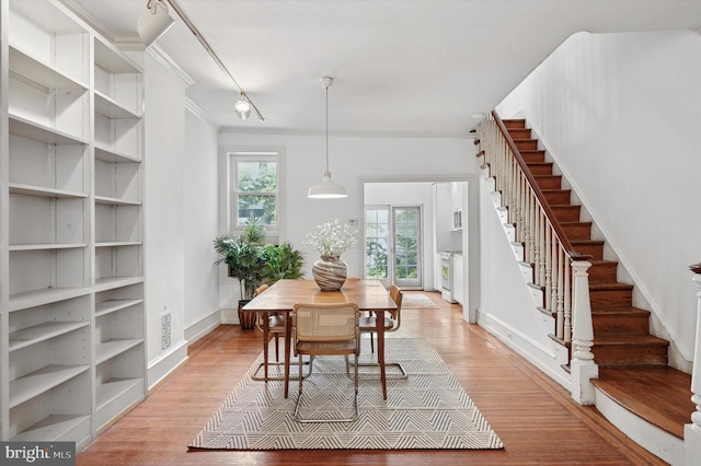 2205 Pine St, Philadelphia, PA 19103 - dining space with stairway, ornamental molding, and light wood-style flooring