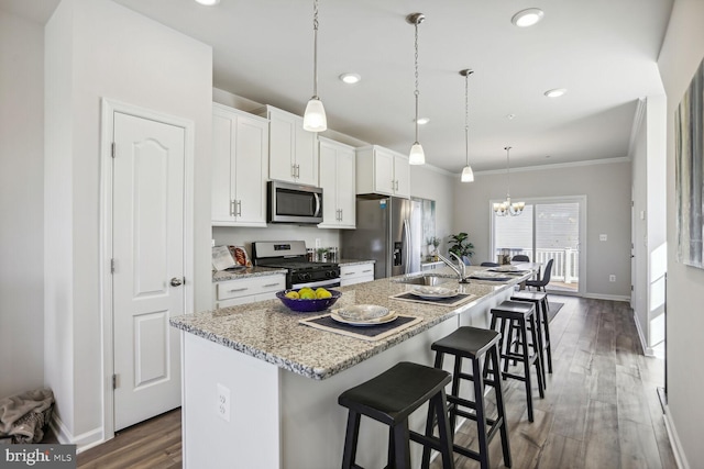 HOMESITEV43 Aiden Way, Upper Marlboro, MD 20774 - kitchen featuring stainless steel appliances, a kitchen island with sink, white cabinets, a chandelier, and wood finished floors