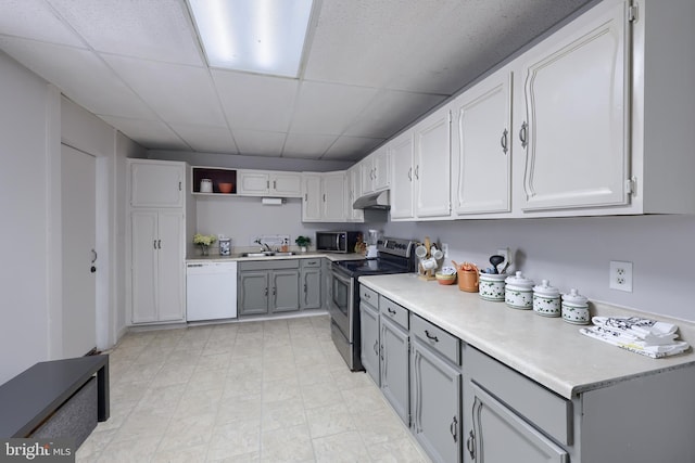 68 Locust St, Lancaster, PA 17602 - kitchen with stainless steel appliances, under cabinet range hood, gray cabinets, a drop ceiling, and open shelves
