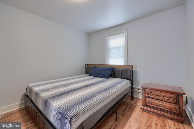 68 Locust St, Lancaster, PA 17602 - bedroom featuring light wood-style flooring and baseboard heating