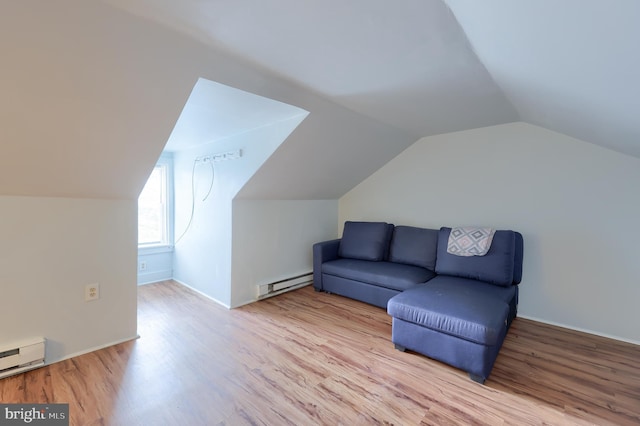 68 Locust St, Lancaster, PA 17602 - living area featuring a baseboard radiator, wood finished floors, and lofted ceiling