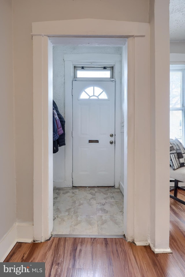 68 Locust St, Lancaster, PA 17602 - entryway with baseboards and wood finished floors