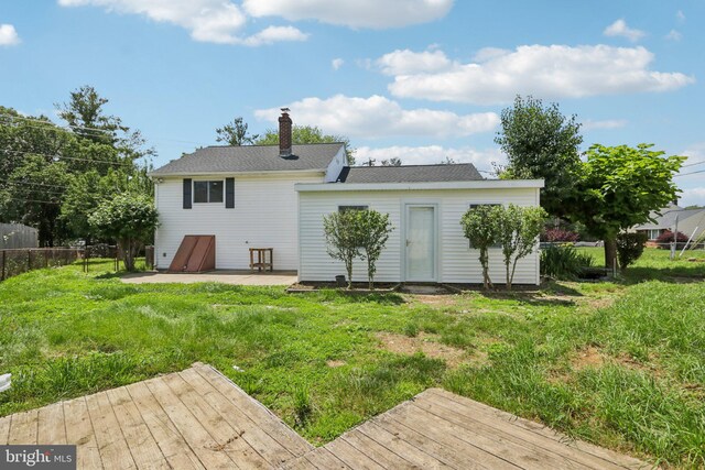 1 Russell Rd, New Castle, DE 19720 - back of house with a patio, a wooden deck, and a chimney