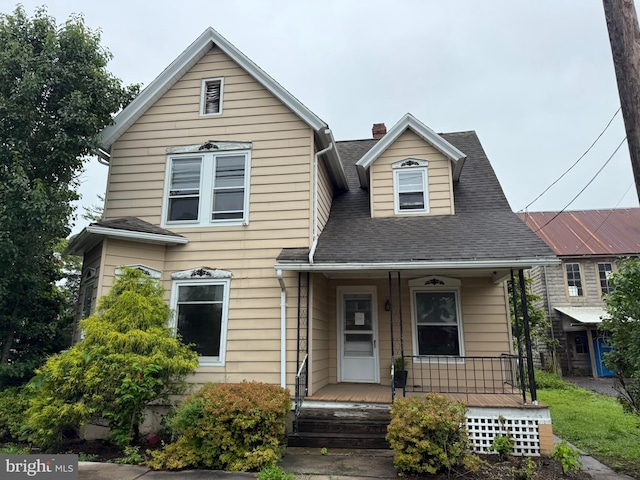 77 Spring St, Beaver Springs, PA 17812 - view of front facade featuring a porch, a chimney, and roof with shingles