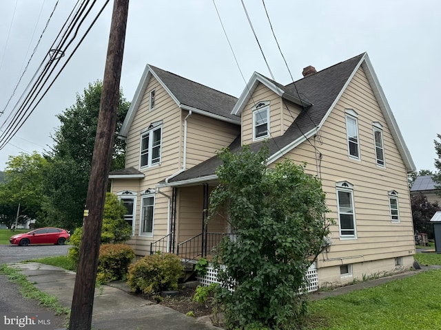 77 Spring St, Beaver Springs, PA 17812 - view of front of house featuring roof with shingles and a chimney