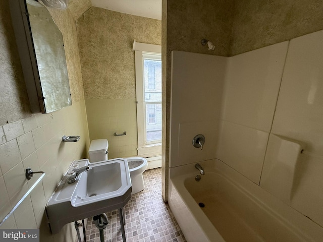 77 Spring St, Beaver Springs, PA 17812 - bathroom with tile walls,  shower combination, and tile patterned floors