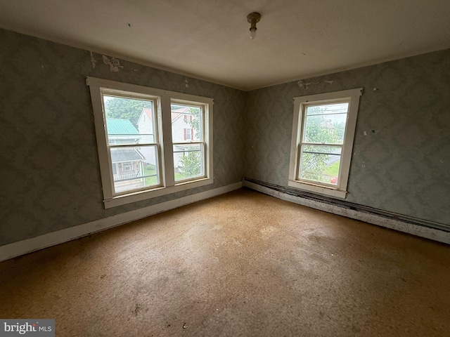 77 Spring St, Beaver Springs, PA 17812 - unfurnished room featuring light carpet and a baseboard heating unit