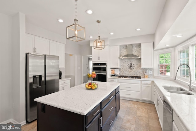 10207 Daylily Ct, Manassas, VA 20110 - kitchen with appliances with stainless steel finishes, wall chimney range hood, white cabinets, decorative backsplash, and recessed lighting
