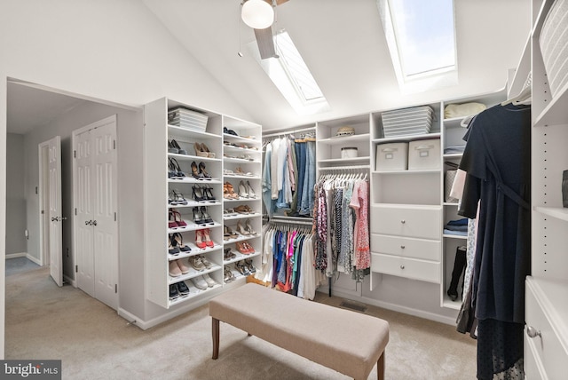 10207 Daylily Ct, Manassas, VA 20110 - spacious closet featuring carpet floors, lofted ceiling, and a skylight