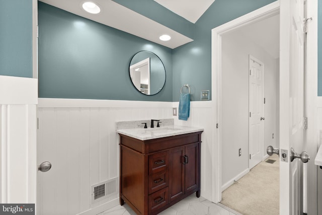 10207 Daylily Ct, Manassas, VA 20110 - bathroom featuring vanity and a wainscoted wall