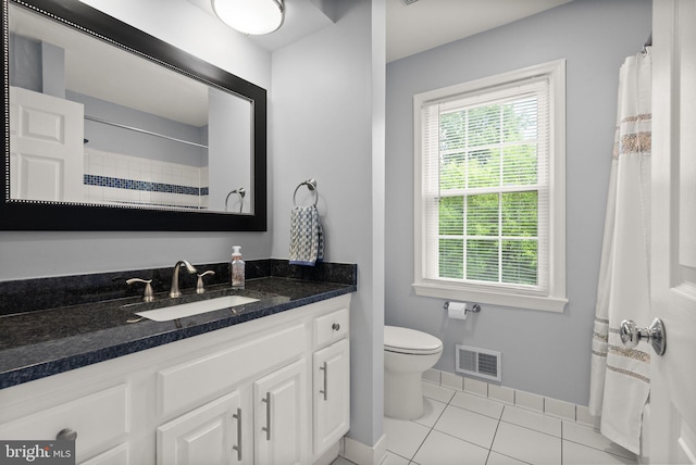 10207 Daylily Ct, Manassas, VA 20110 - full bath featuring vanity, tile patterned floors, and a shower with shower curtain