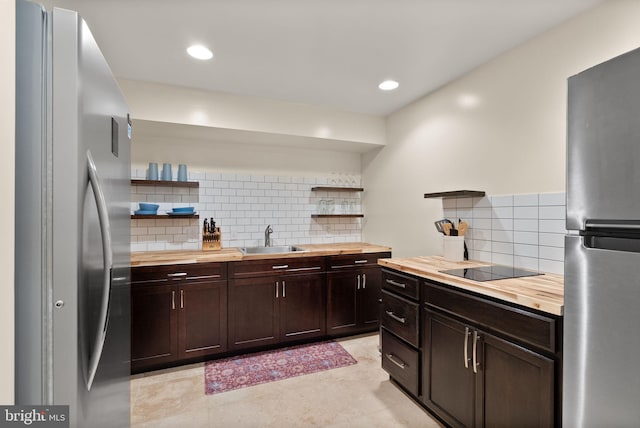 10207 Daylily Ct, Manassas, VA 20110 - kitchen with butcher block countertops, open shelves, freestanding refrigerator, and recessed lighting