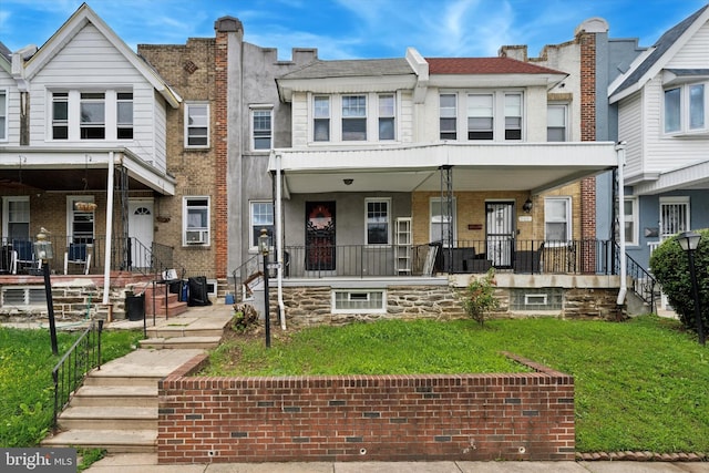 363 E Sharpnack St, Philadelphia, PA 19119 - townhome / multi-family property with covered porch and a front lawn