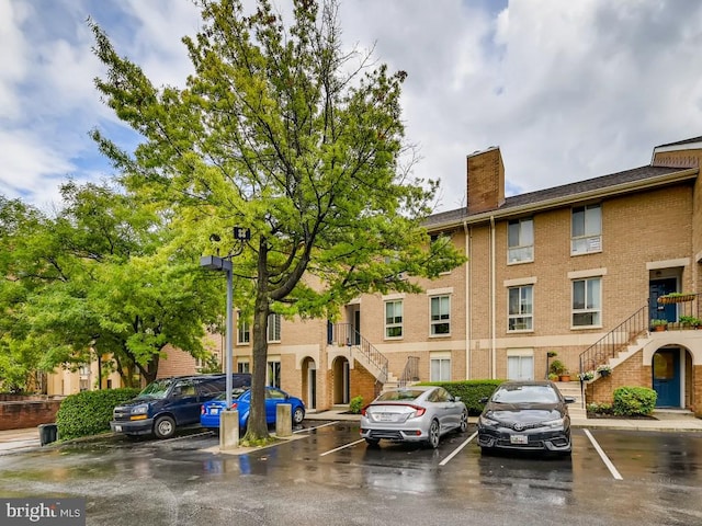 108 W Barre St Unit R 48, Baltimore, MD 21201 - view of property featuring stairs and uncovered parking
