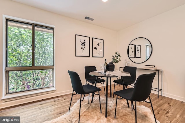 108 W Barre St Unit R 48, Baltimore, MD 21201 - dining area with baseboards and light wood-style floors