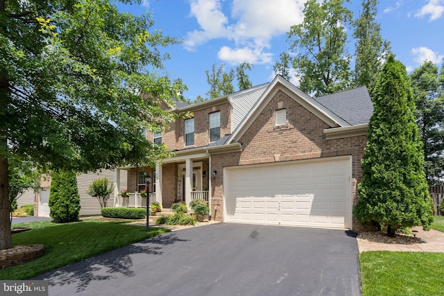 5696 Liberty Manor Cir, Woodbridge, VA 22193 - view of front of house featuring driveway, brick siding, an attached garage, a porch, and a front lawn
