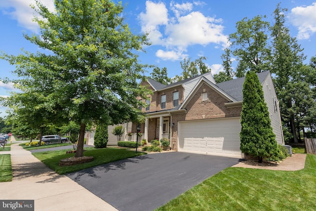 5696 Liberty Manor Cir, Woodbridge, VA 22193 - view of front of property featuring driveway, a front yard, brick siding, and a garage