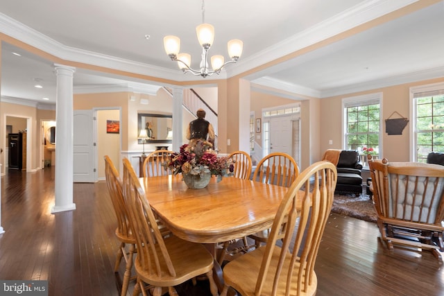 5696 Liberty Manor Cir, Woodbridge, VA 22193 - dining space with hardwood / wood-style floors, decorative columns, crown molding, and a chandelier