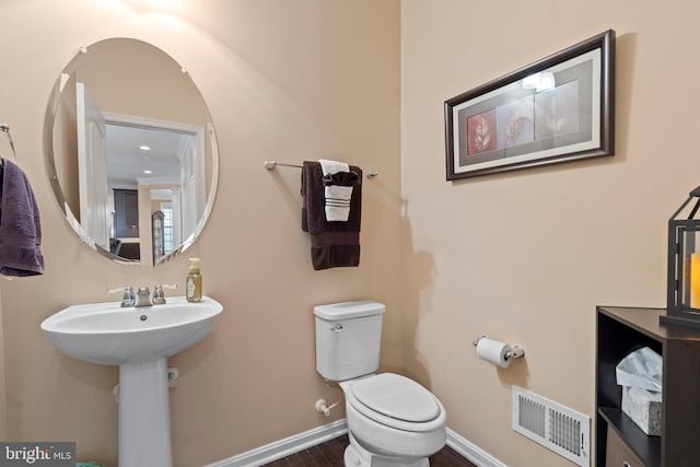 5696 Liberty Manor Cir, Woodbridge, VA 22193 - half bath featuring toilet and wood finished floors