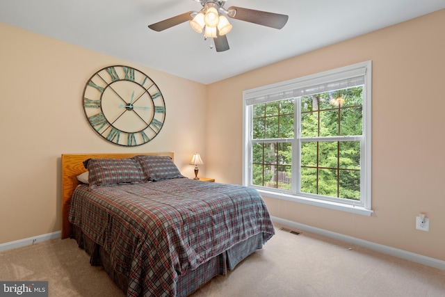 5696 Liberty Manor Cir, Woodbridge, VA 22193 - bedroom featuring carpet floors, multiple windows, and ceiling fan