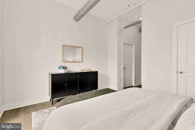 301 Massachusetts Ave NW Unit 1103, Washington, DC 20001 - bedroom with baseboards and wood finished floors