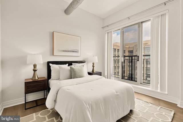 301 Massachusetts Ave NW Unit 1103, Washington, DC 20001 - bedroom with access to exterior and wood finished floors