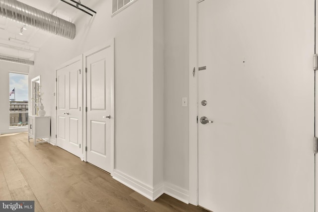 301 Massachusetts Ave NW Unit 1103, Washington, DC 20001 - hallway featuring wood finished floors and baseboards