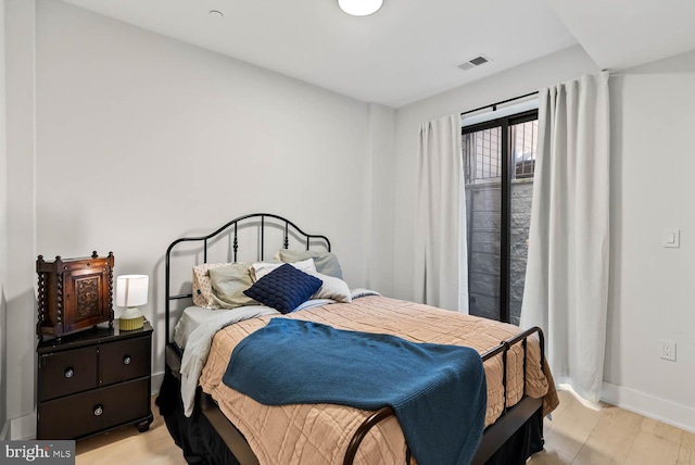 1471 Harvard St NW Unit 2, Washington, DC 20009 - bedroom with baseboards and light wood-style floors