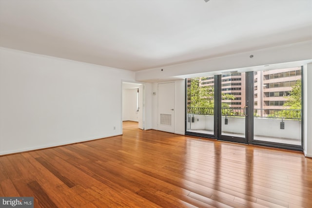 1200 Crystal Dr Unit 514, Arlington, VA 22202 - spare room with wood finished floors and baseboards