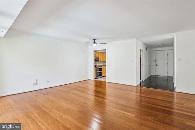 1200 Crystal Dr Unit 514, Arlington, VA 22202 - unfurnished living room featuring hardwood / wood-style floors and a ceiling fan