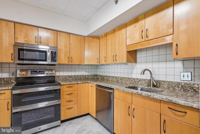 1200 Crystal Dr Unit 514, Arlington, VA 22202 - kitchen with appliances with stainless steel finishes, tasteful backsplash, and light stone counters
