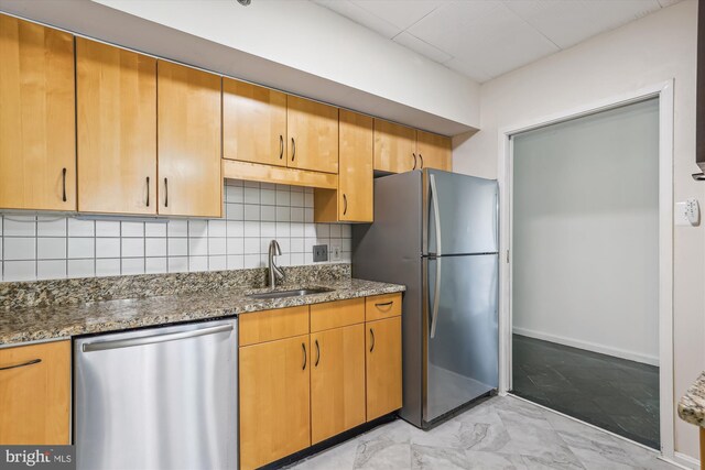 1200 Crystal Dr Unit 514, Arlington, VA 22202 - kitchen featuring stainless steel appliances, dark stone countertops, backsplash, and light marble finish floors