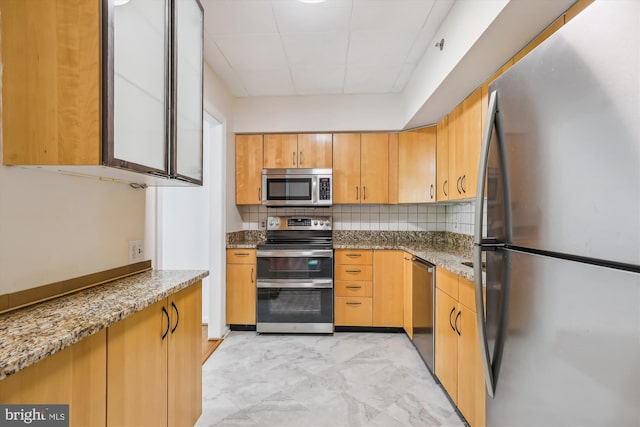 1200 Crystal Dr Unit 514, Arlington, VA 22202 - kitchen with stainless steel appliances, light stone counters, backsplash, and a drop ceiling
