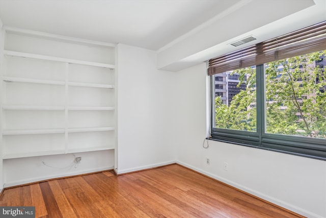 1200 Crystal Dr Unit 514, Arlington, VA 22202 - unfurnished room featuring wood finished floors and baseboards